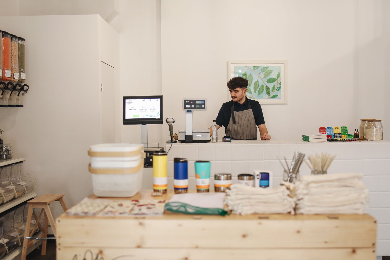 Local shop owner serving a customer
