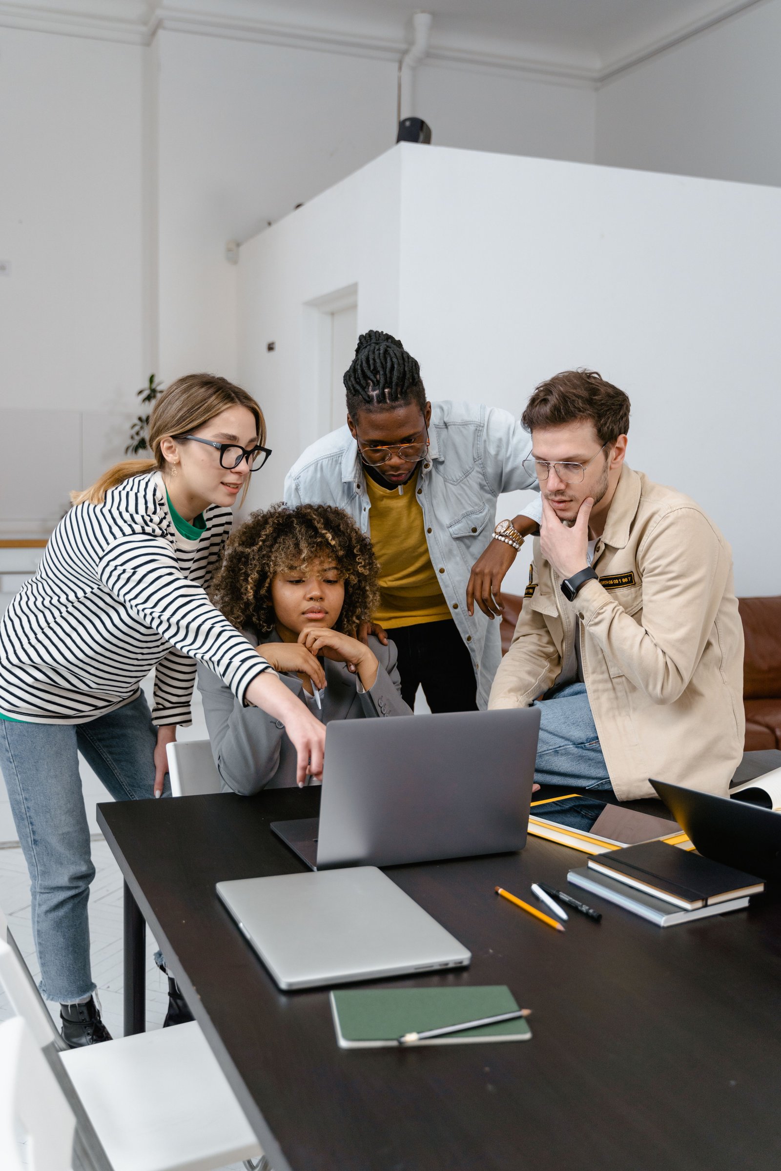 Team planning website content and structure with a laptop